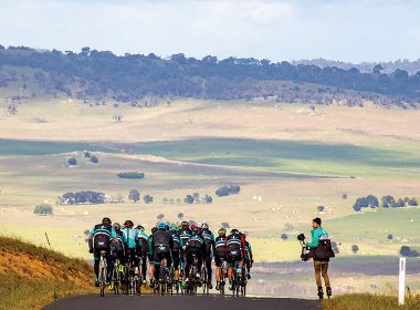 group of cyclists on a mountain road