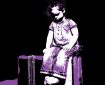 Child sits on a suitcase