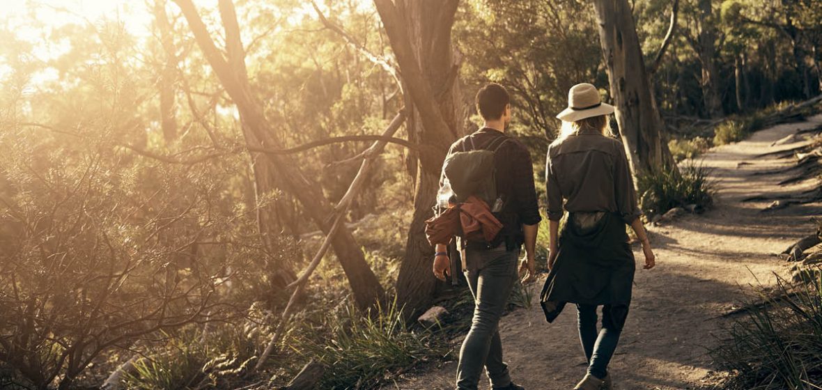 Man and woman walking on a nature trail