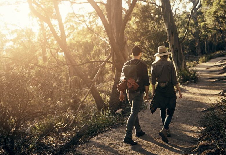 Man and woman walking on a nature trail