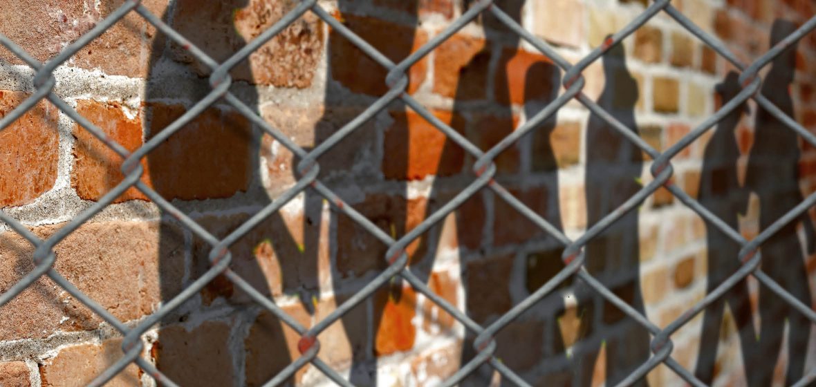 Chain-link fence outside a prison exercise yard