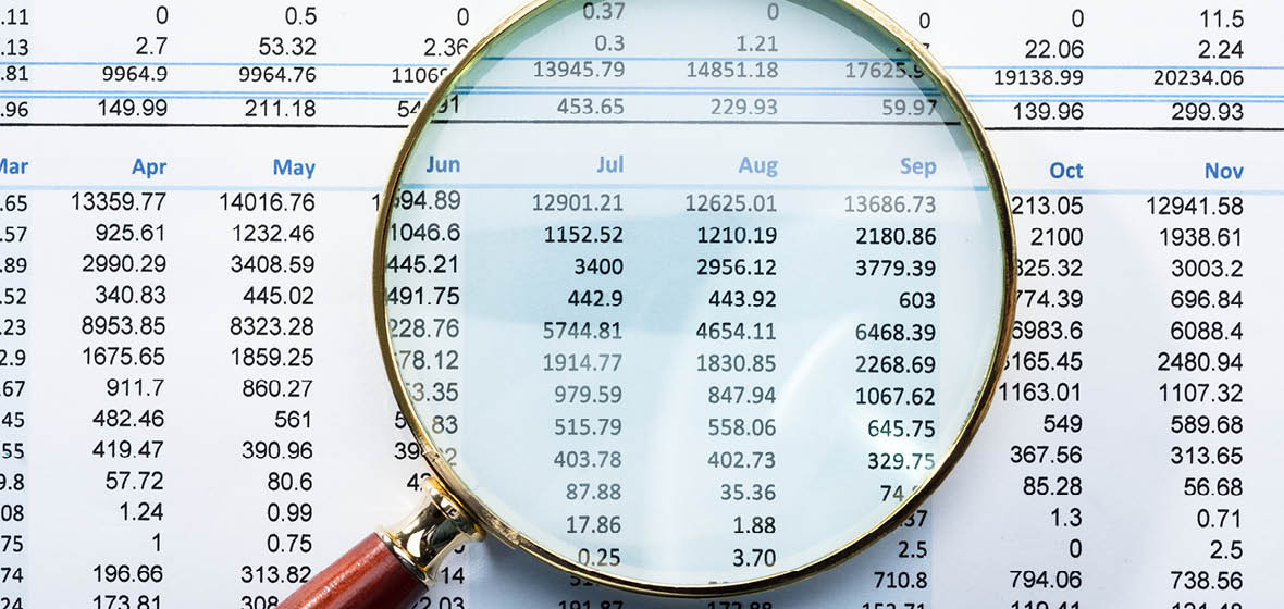 Magnifying glass highlighting figures on a financial statement
