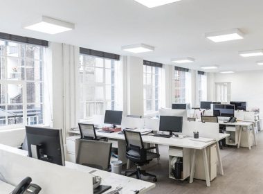 empty office with computers and desks.