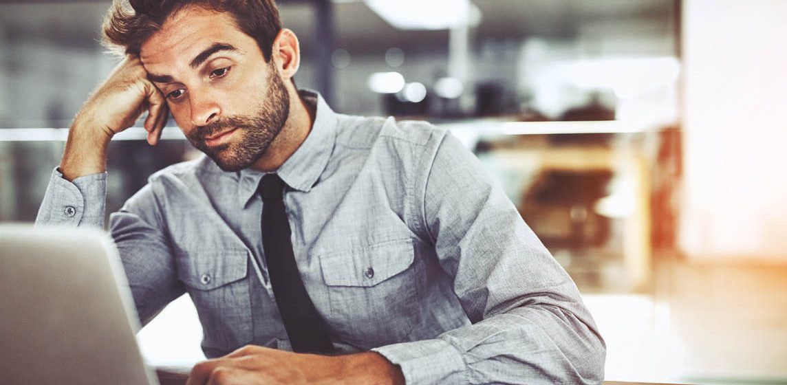 stressed man at desk