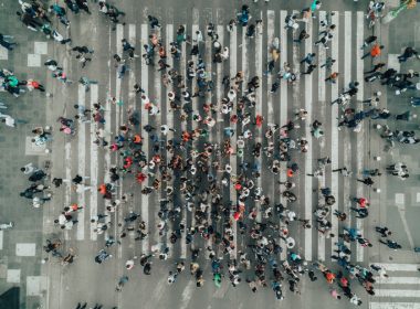 Aerial view of a crowd crossing a pedestrian crossing