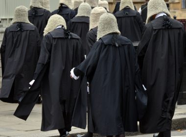 British judges wearing traditional ceremonial wigs and robes in a procession at Westminster, London