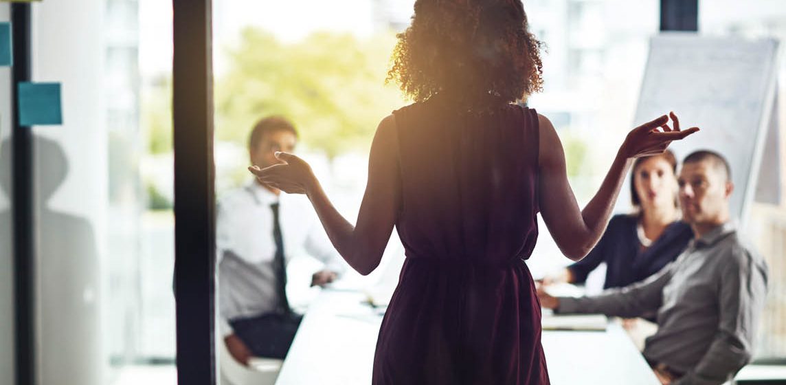 woman presenting to room