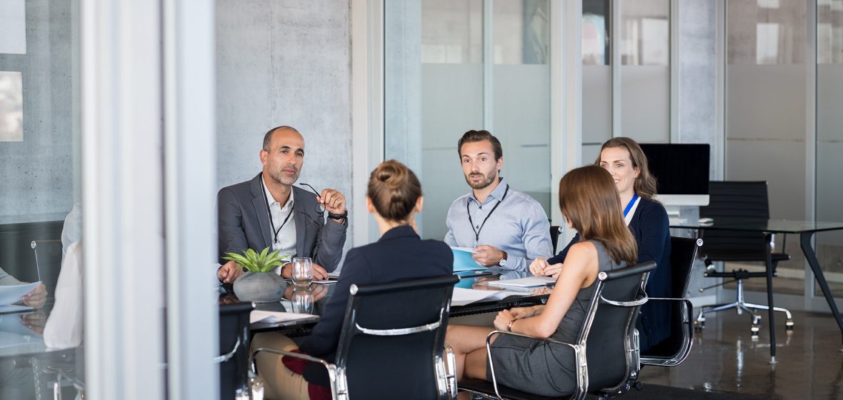 Solicitors and clients sitting at a table