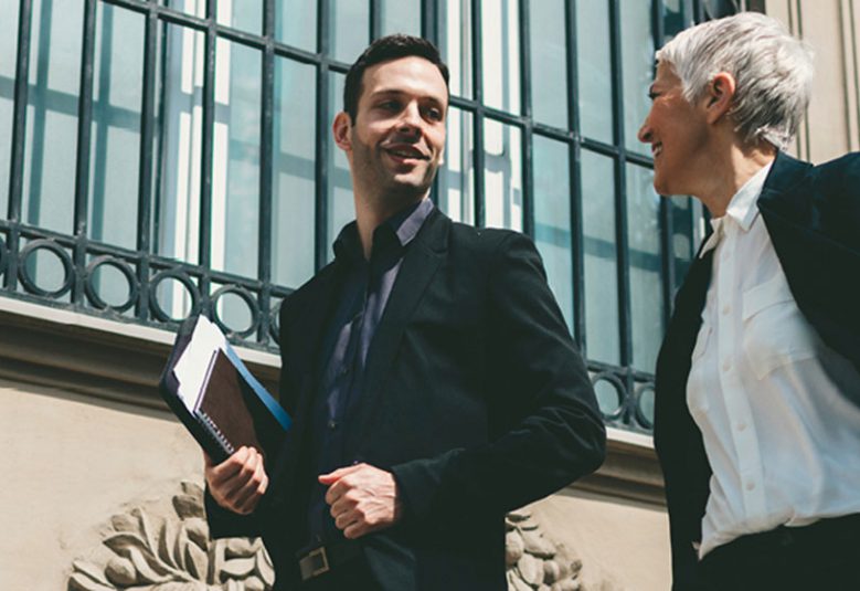 Man and woman walking outside in the city