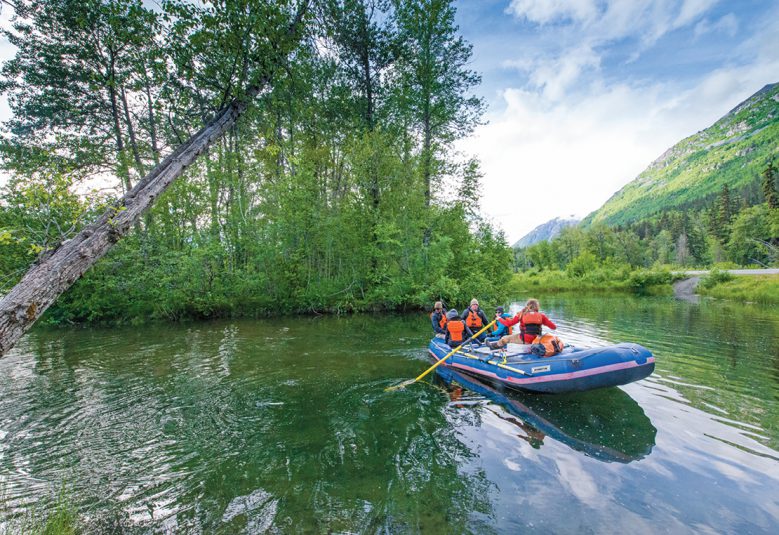 group in boat on river