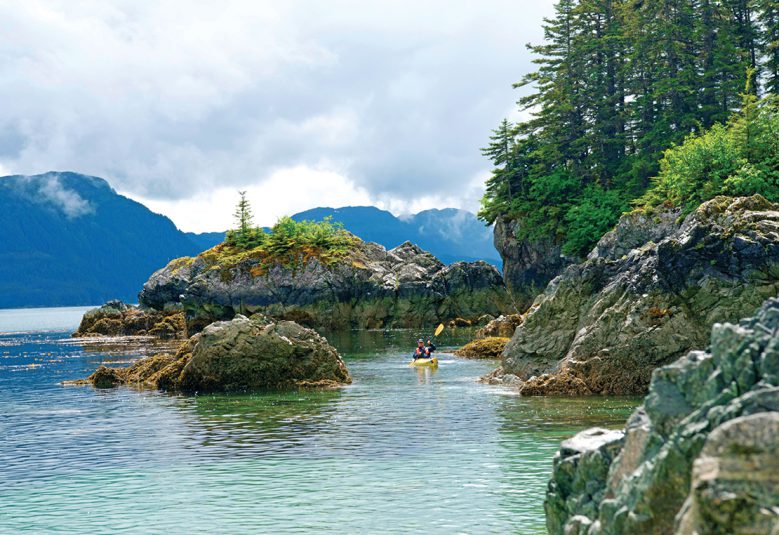 person kayaking in Alaska