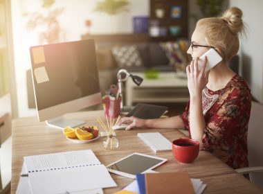 Woman works at a desk in a home office