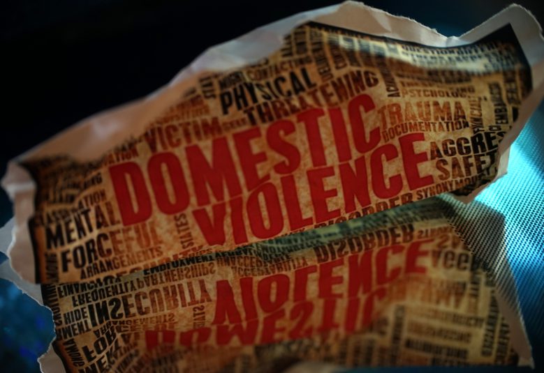 Fictional newspaper with domestic violence headline