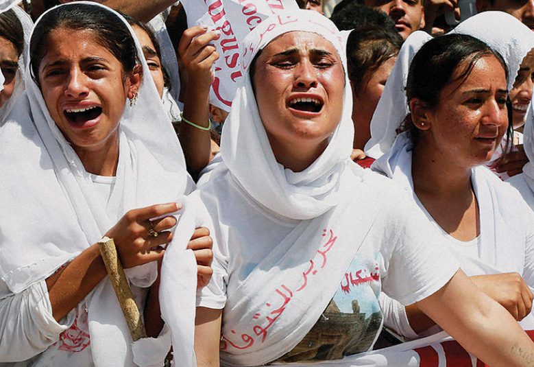 Yazidi Kurdish women chant slogans during a protest against the Islamic State in Dohuk, northern Iraq, 3 August 2015