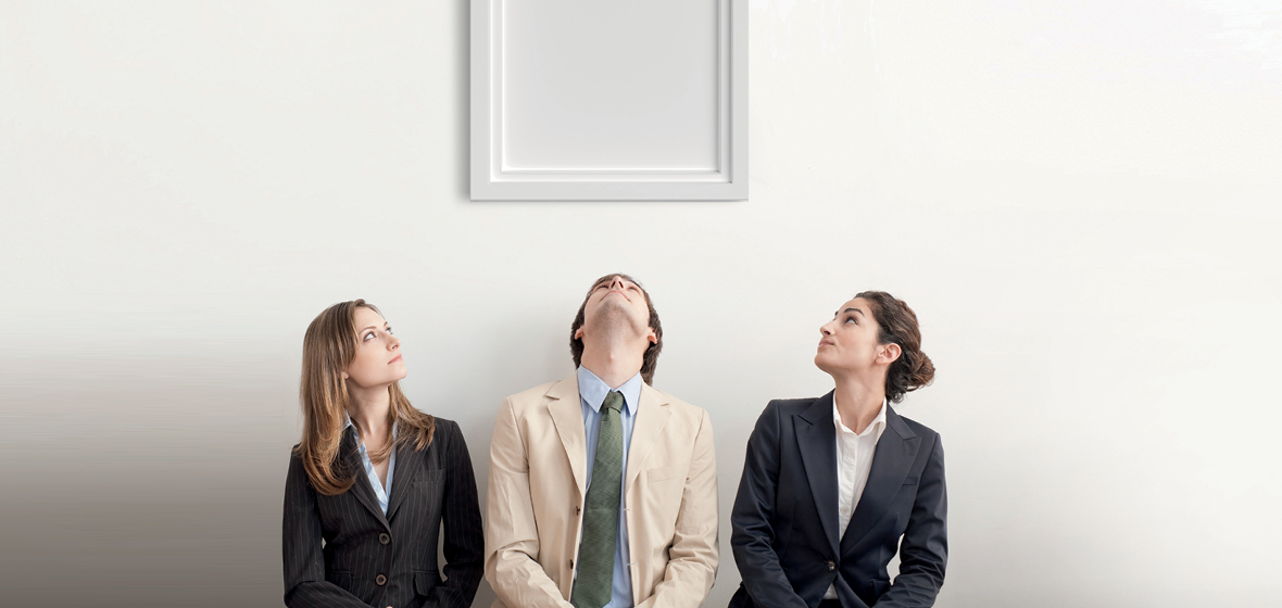 Three people looking up at an empty picture frame