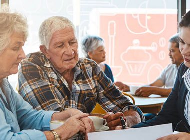 Solicitor reviews a document with an older couple