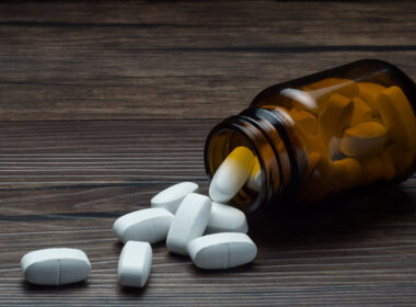 medicine bottle with pills spilling out