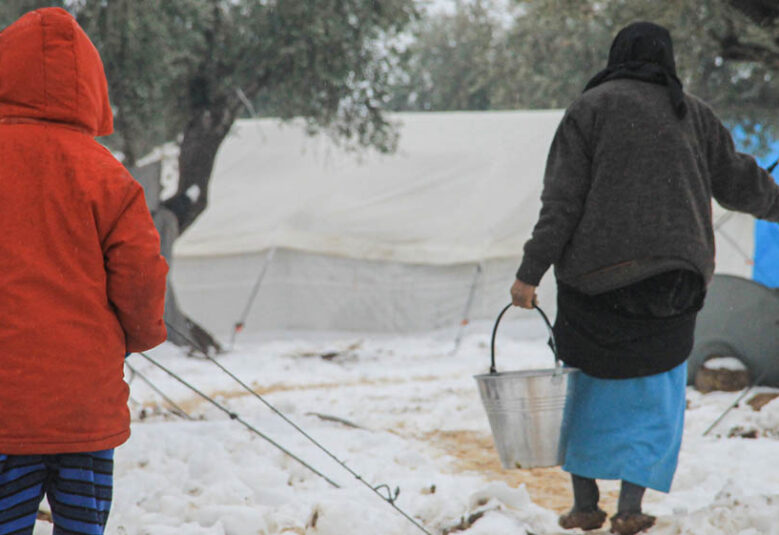 photo of three tents in a refugee camp in Syria