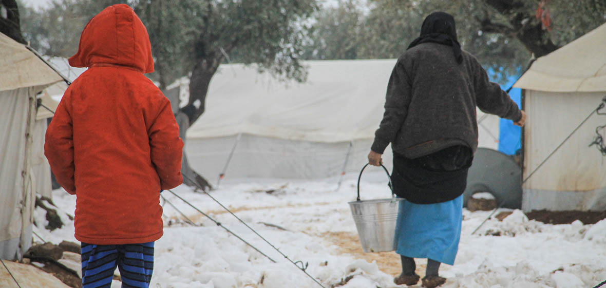 photo of three tents in a refugee camp in Syria