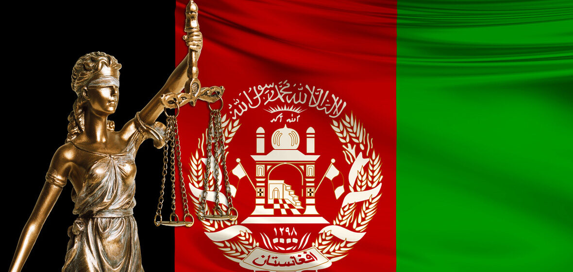 photo of Afghan flag and statue of lady justice