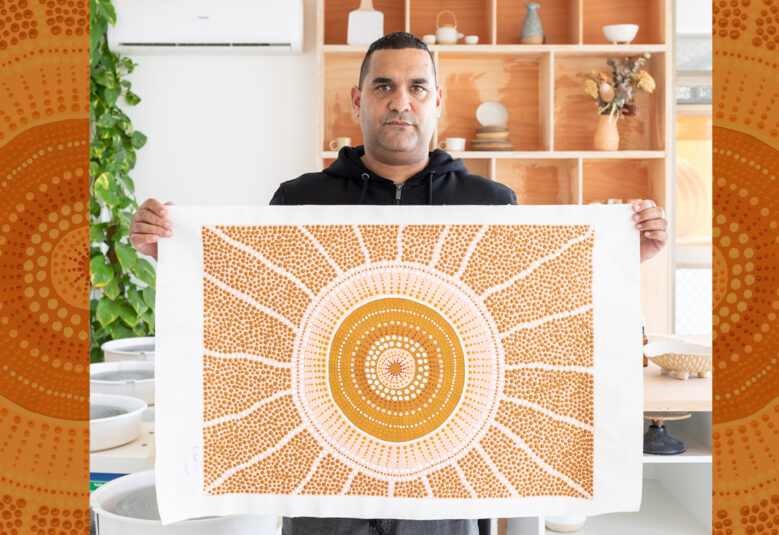 picutre of Indigenous man with art work to illustrate arts law centre work