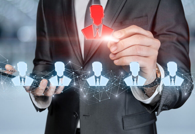 pciture of man in suit with images of heads connected to networks to show ai recruitment