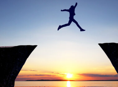 photo of person leaping across a gap to show legal career offers access to other professions