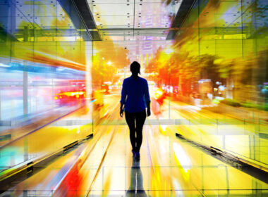 image of women walking towards the light in a colourful tunnel